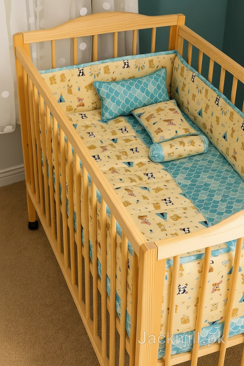 Yellow and turquoise animal print baby crib bedding set with bears, bunnies, and pandas, including quilt, bumpers, and pillows in a wooden cot.